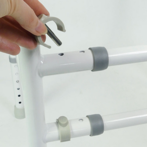 Close-up of height adjustable toilet frame.
