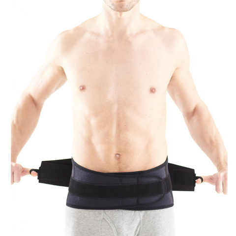 Male and female models wearing the back support to illustrate its unisex, universal fit.