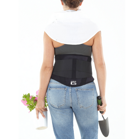Back view of a person using the brace during a light workout or stretch, showing flexibility and comfort.