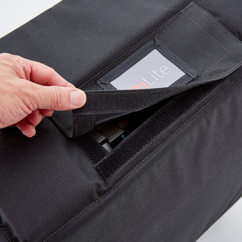 Mlite travel bag for folding mlite scooter, shows a cover at the top of the bag that can be removed for the top handle to be extended like a suitcase for easier transport 