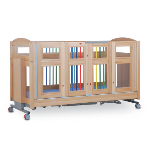 The cot positioned inside a transport setting, emphasizing its safety for travel and compliance with strict standards.