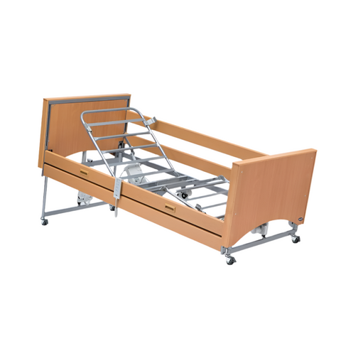 Person sitting up comfortably in an Invacare Medley bed with backrest elevated.