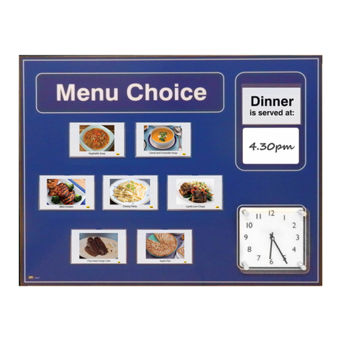 A menu board displaying meal options with 240 high-quality food images, including cards for breakfast, lunch, dinner, tea, and snacks. The board features a large analogue clock for time orientation and a dry-wipe area for easy meal updates.